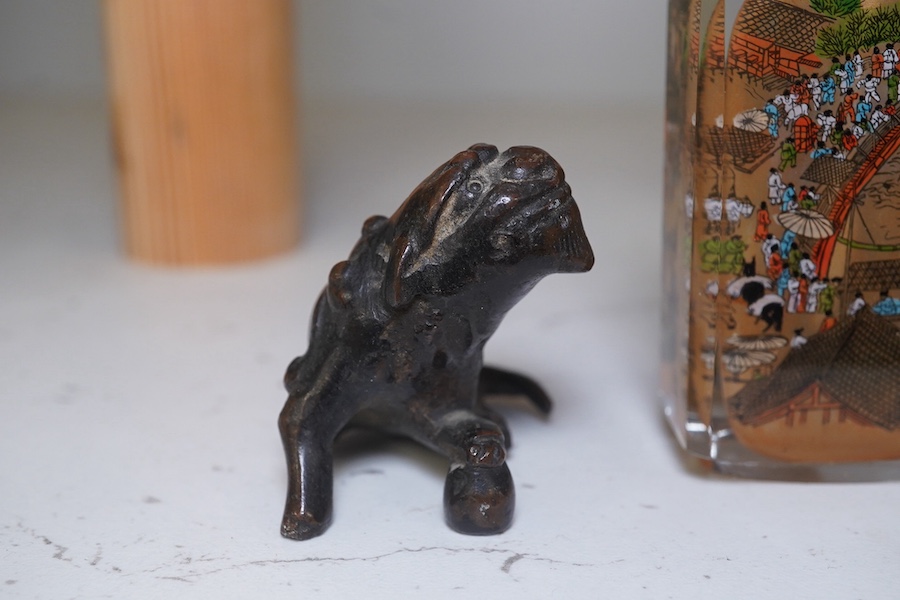 A Japanese bronze koro and cover, 23.5cm high, together with a inside painted glass snuff bottle, 8.5cm high. Condition - fair, dog detached from cover of koro, etc.